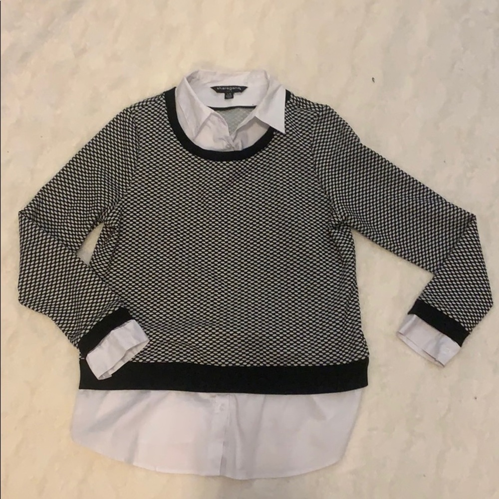 Black and white pattern sweater with collar.